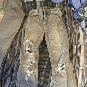 I am selling a size double zero ripped gray skinny jeans